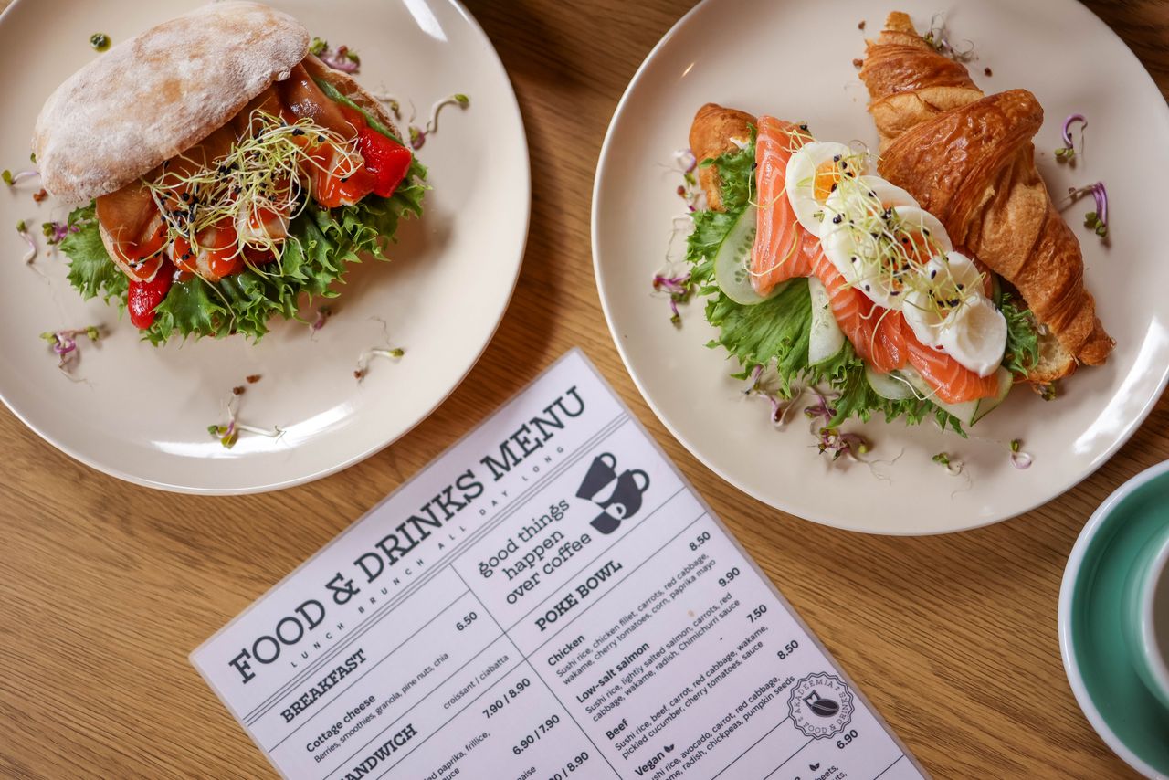 Tasty croissant sandwich with salmon and ciabatta with vegetables, perfect for a balanced meal.